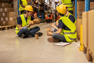 Warehouse workers enjoying lunch break together