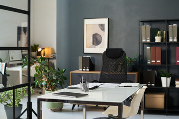 Workplace of manager in boardroom in modern office