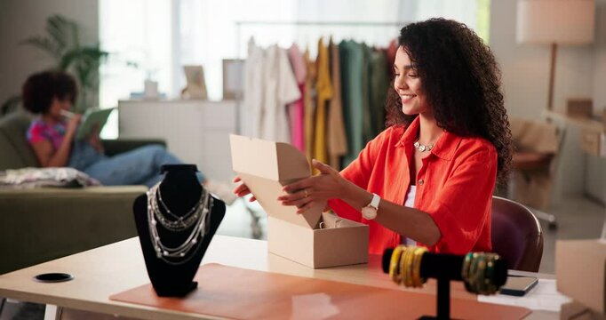 Jewelry, box and small business with woman in office for designer, ecommerce and order. Online boutique, startup and dropshipping with person and necklace for inventory, logistics and entrepreneur