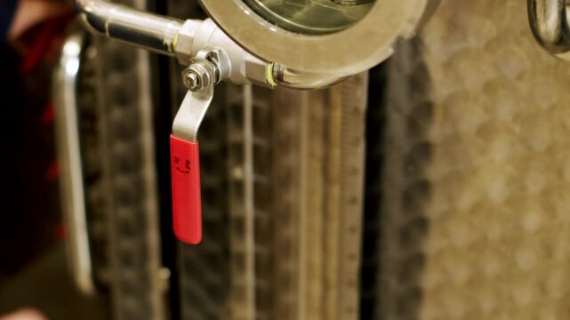 Close-Up of Copper Distillation Apparatus with Pressure Gauge and Viewing Ports
