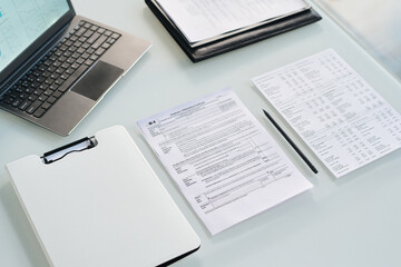 High angle view of business documents on workplace in office