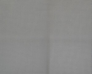 A textured fabric in neutral gray tones, showcasing a close-up view of woven material, ideal for design and textile applications.