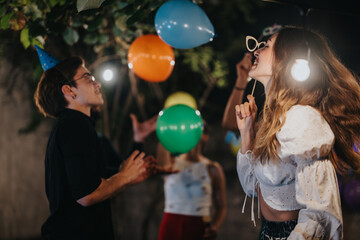 Naklejka premium An outdoor evening celebration with friends having fun, engaging in activities, surrounded by colorful decorations. The lively atmosphere highlights joy, friendship, and togetherness in this festive