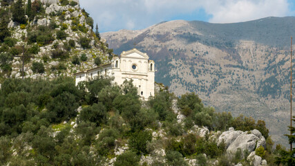 Naklejka premium Aerial view of the church of Santa Maria delle Grazie, a religious building in Sora. It is a small church built on the peak of a mountain. 