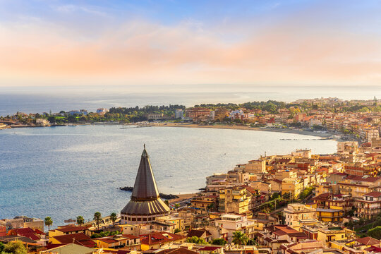 scenic view of old town on a coast line near blue sea gulf. Sunset evening landscape of coastline mediterraneran italian city. - Powered by Adobe