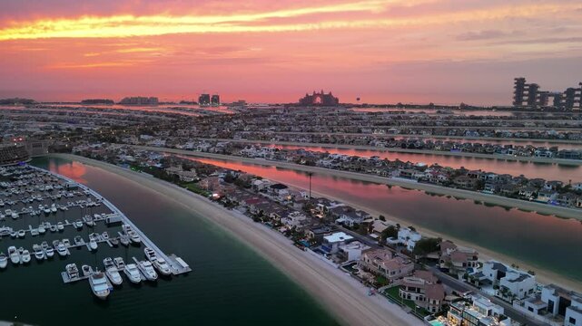 Dubai, UAE: Aerial view of capital city of Emirate of Dubai, artificial islands beach district of Palm Jumeirah - landscape panorama of Arabian Peninsula from above
