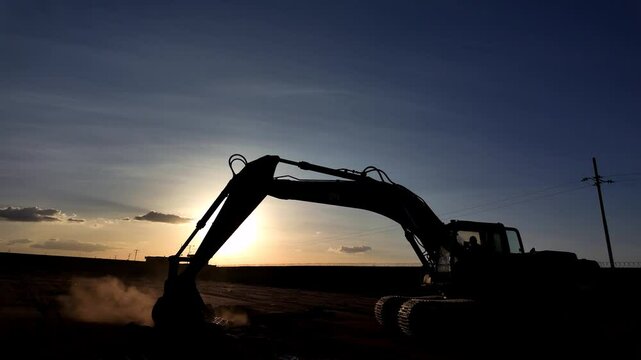 excavator at sunset