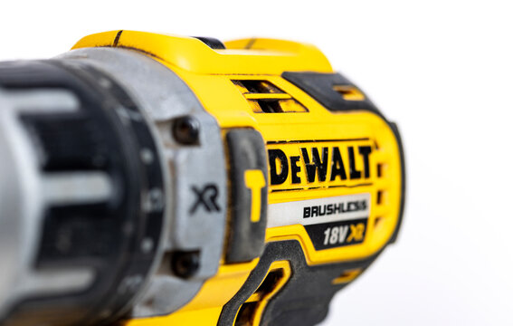 Close up of a used dewalt 18v xr brushless drill, highlighting its rugged construction and power