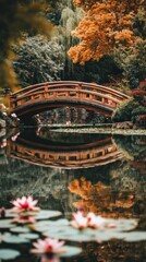Naklejka premium Tranquil waters mirroring the Japanese bridge amidst autumn foliage in the garden