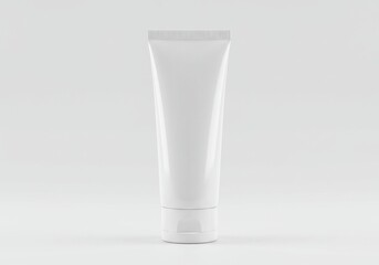 A minimalistic shot of a white tube container standing upright on a white surface in a studio setting