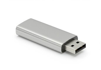 A silver usb flash drive with a rectangular shape isolated on a plain white background surface view