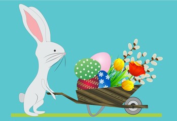 Easter composition with wheelbarrow, easter eggs and hare