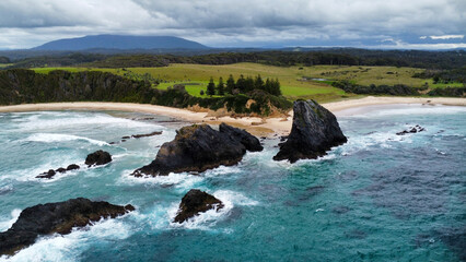 Rocks off the coast in rough seas, seen from above