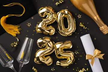 Golden themed graduation party setup featuring decorations, a diploma, and celebratory elements celebrating the year 2025