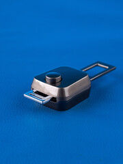 Close up of mobile seat belt extender on blue background