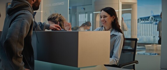 Airport Terminal: Close Up of Female Airline Worker Talking and Checking Documents of Passenger at...