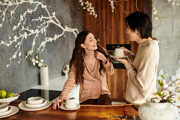 Couple happily planning their wedding in a warm, lovingly decorated kitchen