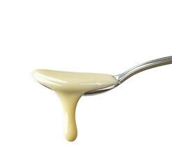 Sour cream in a spoon on a  Creamy white substance spills from a silver spoon onto a light gray  white background 

