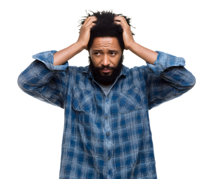 A man with an afro and beard holds his head in distress, showcasing feelings of anxiety, worry, and stress against a solid black background. - Powered by Adobe