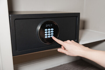 Hand Pressing Code On Digital Hotel Safe