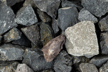 Volcanic basalt stone surface with rough texture, captured close-up