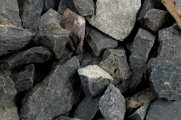 Volcanic basalt stone surface with rough texture, captured close-up