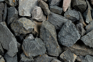 Volcanic basalt stone surface with rough texture, captured close-up