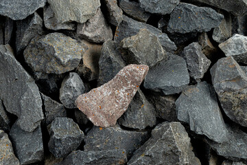 Volcanic basalt stone surface with rough texture, captured close-up