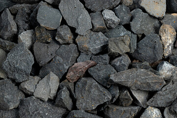 Volcanic basalt stone surface with rough texture, captured close-up