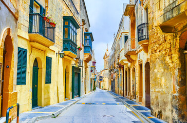 Fototapeta premium Historical St Paul street with old residential houses in Rabat, Malta