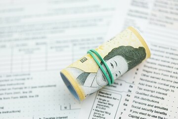 South Korean won money bills in big amount lies on table with tax forms close up