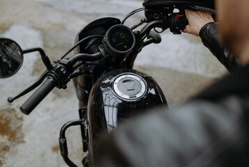 A close-up view of a motorcycle's controls and fuel tank, showing a rider ready to hit the road...