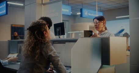 Diverse Passengers at Airport Check-in Counter: Female Airline Worker Giving Documents, Boarding...