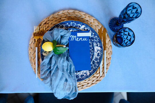 Elegant Table Setting with Blue and Yellow Accents for Special Occasions