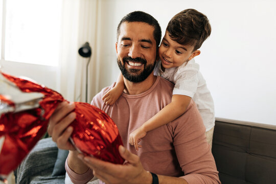 Fototapeta Father and son celebrating easter at home