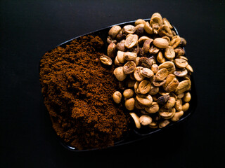 roasted coffee beans on black background