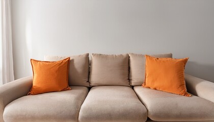 minimalist interior design of modern living room beige fabric sofa with bright orange pillows