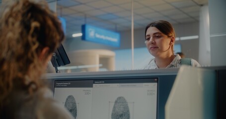Airport Check-in Counter: Woman Giving Documents and Airplane Ticket to Female Airline Agent for...