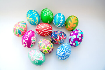 Painted eggs with different patterns on a white background