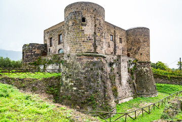 Old medieval Aragonese Castle surrounded by green fields in in Calvi Risorta, Caserta province.