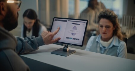 Airport Check-in Counter: Female Airline Worker Checking Tourist Personal ID Data for Flight. Man...