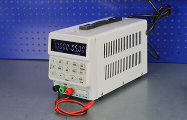 Laboratory power supply for measuring electrical circuits on a metal surface. 
