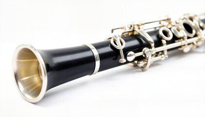 Close-up of a clarinet with ligature and reed showcasing its elegant details on a white background
