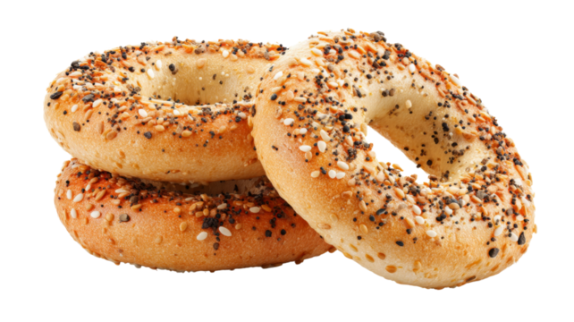 Three everything bagels with sesame seeds, poppy seeds, and onion flakes on transparent background