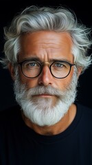 Distinguished senior man with silver hair and beard featuring intense gaze and stylish eyewear, perfect for portrait and fashion design
