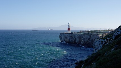 Europa Point Lighthouse guiding ships near Gibraltar, United Kingdom, with Morocco in the background © 4kclips