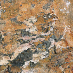 Natural rock formation textures and varied colors in an outdoor environment during daylight
