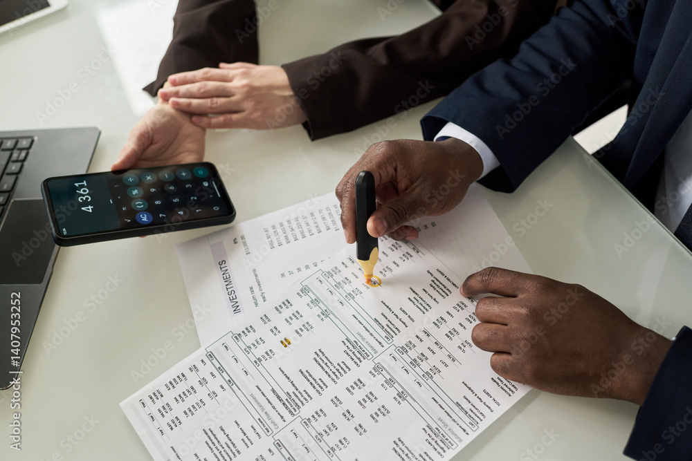 Poster Close-up of colleagues counting data in financial report during their teamwork at table