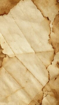 Abstract textured background featuring stained, folded beige paper with torn, deckled edges and mottled brown discolorations