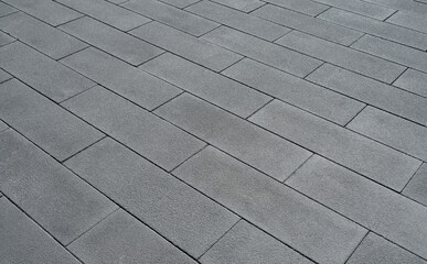 Gray brick pavement, large cement blocks floor background 